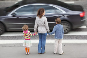 Pedestrian Safety - Mom and 2 kids stop at crosswalk